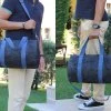 Handcrafted cylindrical travel tote in vibrant tangerine hue perfect for weekend getaways gym sports leisure activities bolsa de lona cilíndrica naranja Reisetasche zylindrisch orange sac polochon cylindrique orange borsa cilindrica arancione weekendtas cilindervorm oranje 旅行袋 橙色 ボストンバッグ オレンジ जिम बैग नारंगी حقيبة رياضية برتقالية mala viagem cilíndrica laranja 더플백 주황색 athletic carryall weekender overnight gym workout fitness yoga sports equipment storage lightweight spacious compartment shoulder strap versatile casual everyday vacation holiday trip unisex men women artisan handmade unique statement piece modern minimalist trendy fashion accessories
