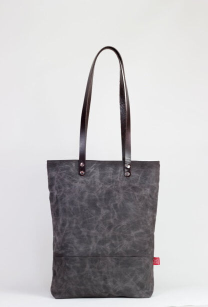 Waxed tote bag with leather strap
